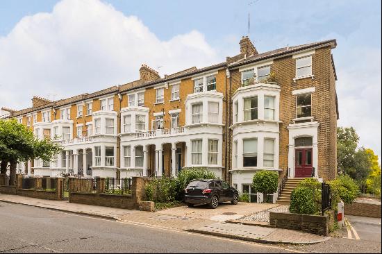 An exceptional, two bedroom flat in a period conversion with direct access to a beautiful 