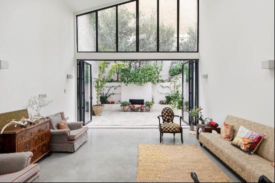 A stunning family home of vast and unique proportions for sale in Kensington, W8.