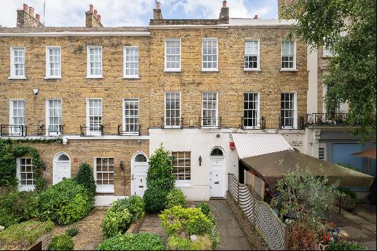 A four bedroom terraced house for sale in NW8.