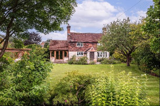 A charming three bedroom Grade ll Listed detached family home, set in the heart of Plaxtol