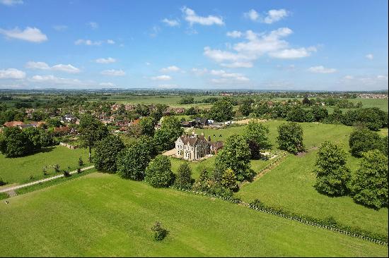 A well-presented and substantial period house with an annexe and stable yard, set in a par