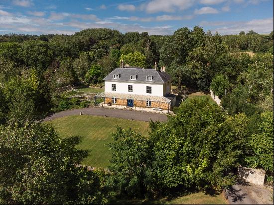 A handsome Grade II listed Georgian country house set in 7 acres of attractive gardens and