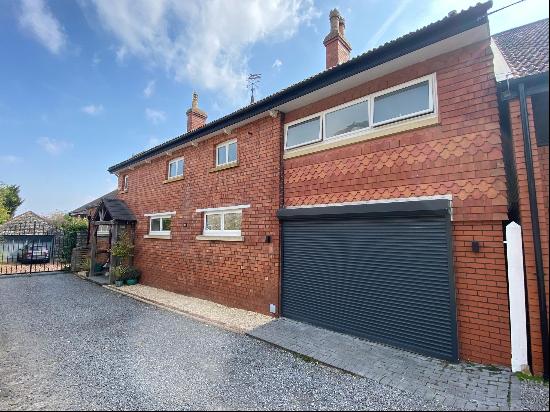 A gorgeous family home in a peaceful location, with four double bedrooms, an open plan kit