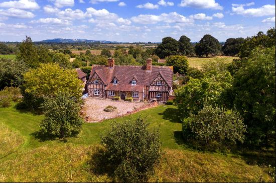 Located in an idyllic position, a beautiful Grade II listed family home set in three acres