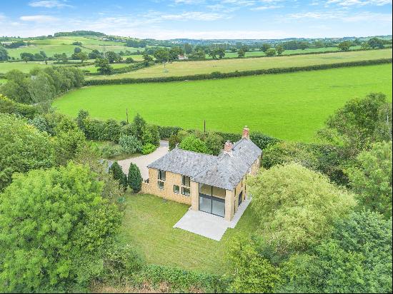 A renovated and extended Victorian cottage with lovely countryside views in a private peac