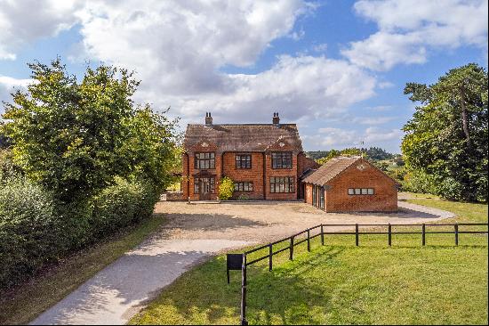 A stunning five-bedroom house with 2.65 acres of garden and paddock with countryside views