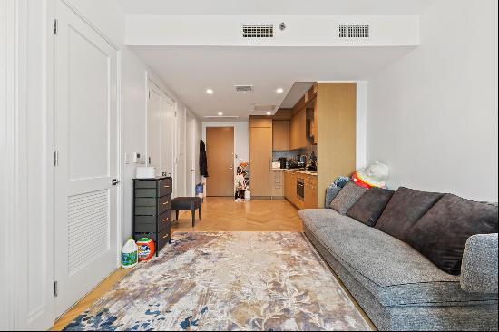 This furnished one-bedroom apartment at 300 W 122nd Street offers a blend of contempora