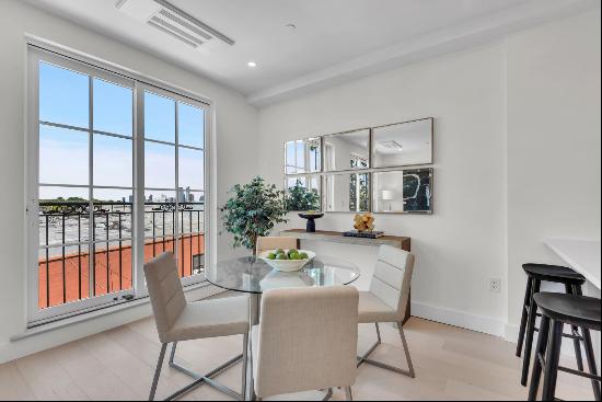 Welcome to the penthouse at 210 Columbia Street, a sunlit triplex nestled in the heart 