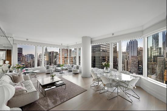 Perched high above Billionaires Row, this upgraded and custom condo has unbeatable view