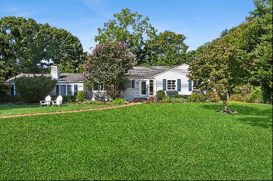 In the heart of the Oneck Estate section of Westhampton Beach Village, this four-bedroom, 