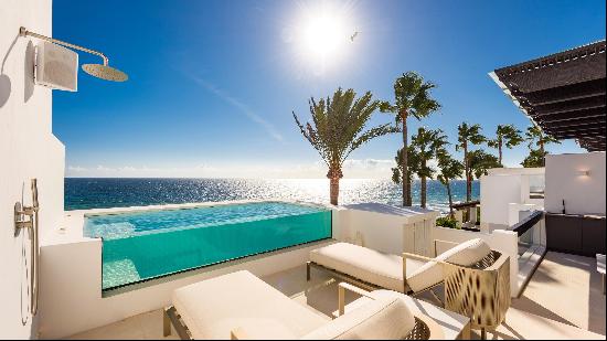 A frontline penthouse apartment with a private swimming pool and spectacular sea views.