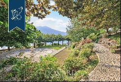 Behind Villa d'Este, a prestigious, finely restored period estate with a park and a lake-v