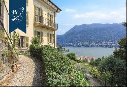 Behind Villa d'Este, a prestigious, finely restored period estate with a park and a lake-v