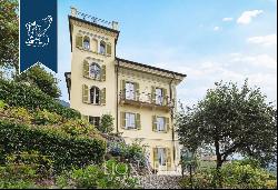 Behind Villa d'Este, a prestigious, finely restored period estate with a park and a lake-v