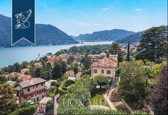 Behind Villa d'Este, a prestigious, finely restored period estate with a park and a lake-v