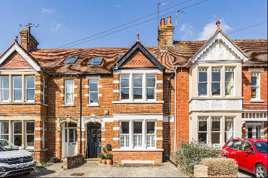 An immaculately presented period home with off-street parking in this sought-after Summert