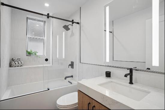 This stunning, fully renovated 2-bedroom, 2-bathroom sponsor unit in the luxurious Arms