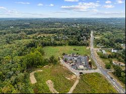 Prime 4.99-acre commercial parcel prominently positioned on Route 164.