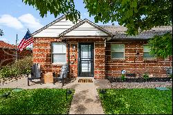 This Refined Residence, a charming brick haven nestled in Denver’s Athmar Park