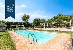 Exclusive relais for sale by Lake Trasimeno, surrounded by vineyards and olive groves