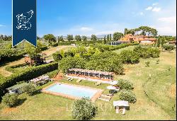 Exclusive relais for sale by Lake Trasimeno, surrounded by vineyards and olive groves