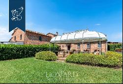 Exclusive relais for sale by Lake Trasimeno, surrounded by vineyards and olive groves