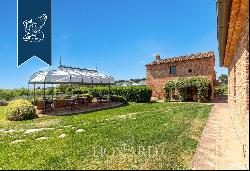 Exclusive relais for sale by Lake Trasimeno, surrounded by vineyards and olive groves