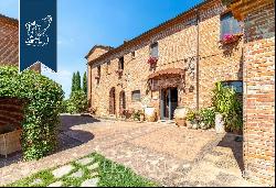 Exclusive relais for sale by Lake Trasimeno, surrounded by vineyards and olive groves