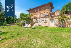 Renovated farmhouse with olive grove and vineyard for sale in the province of Pisa