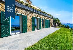 A wonderful modern style design villa is for sale facing the sea that bathes the area betw