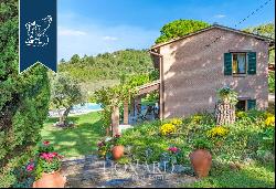 Historic renovated country estate with a swimming pool and olive grove for sale in Urbino