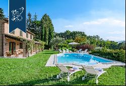 Historic renovated country estate with a swimming pool and olive grove for sale in Urbino