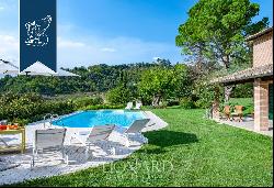 Historic renovated country estate with a swimming pool and olive grove for sale in Urbino