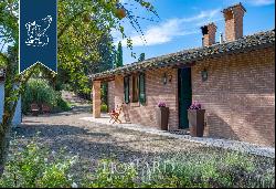 Historic renovated country estate with a swimming pool and olive grove for sale in Urbino