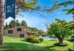 Historic renovated country estate with a swimming pool and olive grove for sale in Urbino