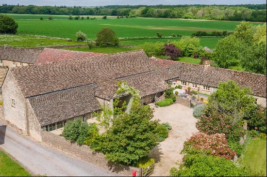 An impressive five bedroom Grade II Listed Cotswold stone barn, offering over 6,000 sq ft 