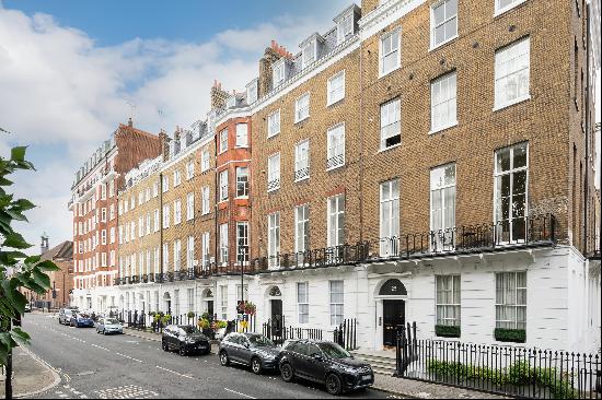 A spacious apartment situated on the lower ground floor of a Grade II listed building on o