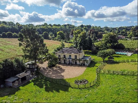 A classically styled house on the edge of the village of Hambledon in East Hampshire with 