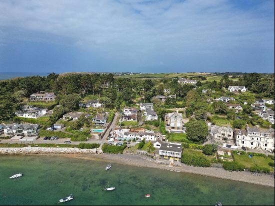 A gorgeous period cottage with superb views overlooking the water, with four bedrooms, lar