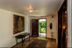 House with views of greenery, the ocean, and Dois Irmaos in a gated community wi