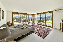 Stunning villa with expansive swimming pool & Lake Lugano views, available for sale in Lu