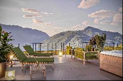 Modern penthouse apartment for sale in Lugano-Carona with breathtaking lake view & roof t