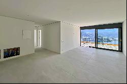 Modern penthouse apartment for sale in Lugano-Carona with breathtaking lake view & roof t