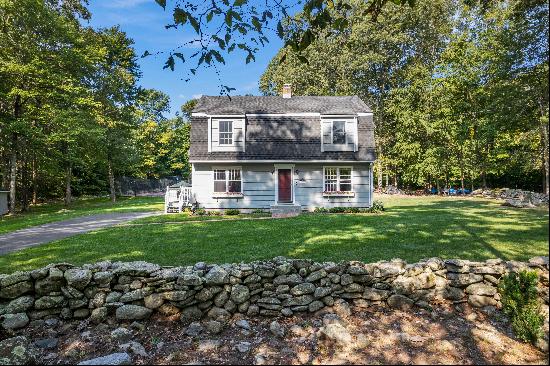 Charming Colonial set back on a private 1.65 acre level lot