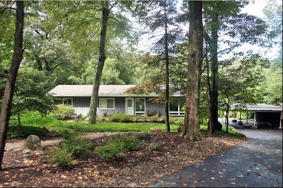 California Ranch on wooded lot.