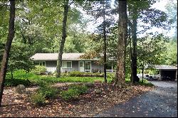 California Ranch on wooded lot.