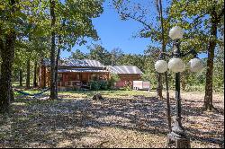 STUNNING LOG CABIN NESTLED ON 3 ACRES