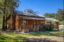 STUNNING LOG CABIN NESTLED ON 3 ACRES