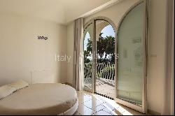 Elegant seafront villa with swimming pool and private garden