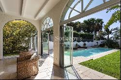 Elegant seafront villa with swimming pool and private garden